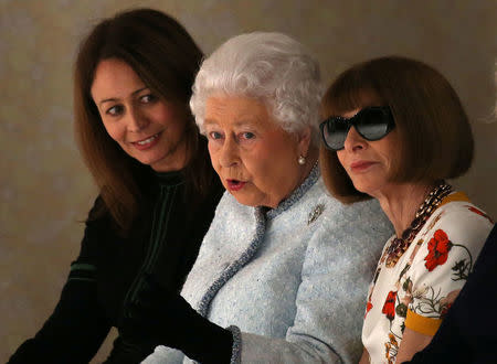 Caroline Rush (L), Chief Executive of the British Fashion Council, Britain's Queen Elizabeth II and Anna Wintour, Editor-in-Chief of Vogue attend the Richard Quinn show at London Fashion Week, in London, Britain February 20, 2018. REUTERS/Paul Hackett