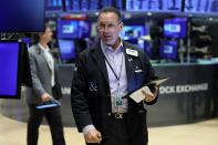 Traders work on the floor of the NYSE in New York