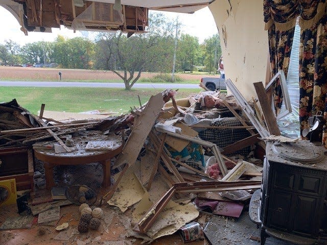 Greg Reasoner suffered minor injuries Friday after a car crashed into the living room of his house on state Route 4 in Marion County. The house was built in 1894 by his great-grandfather, George Hill, and six generations have lived in the house to this day.