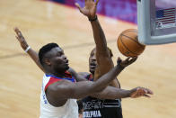 New Orleans Pelicans forward Zion Williamson drives to the basket against Philadelphia 76ers center Dwight Howard in the second half of an NBA basketball game in New Orleans, Friday, April 9, 2021. The Pelicans won 101-94. (AP Photo/Gerald Herbert)