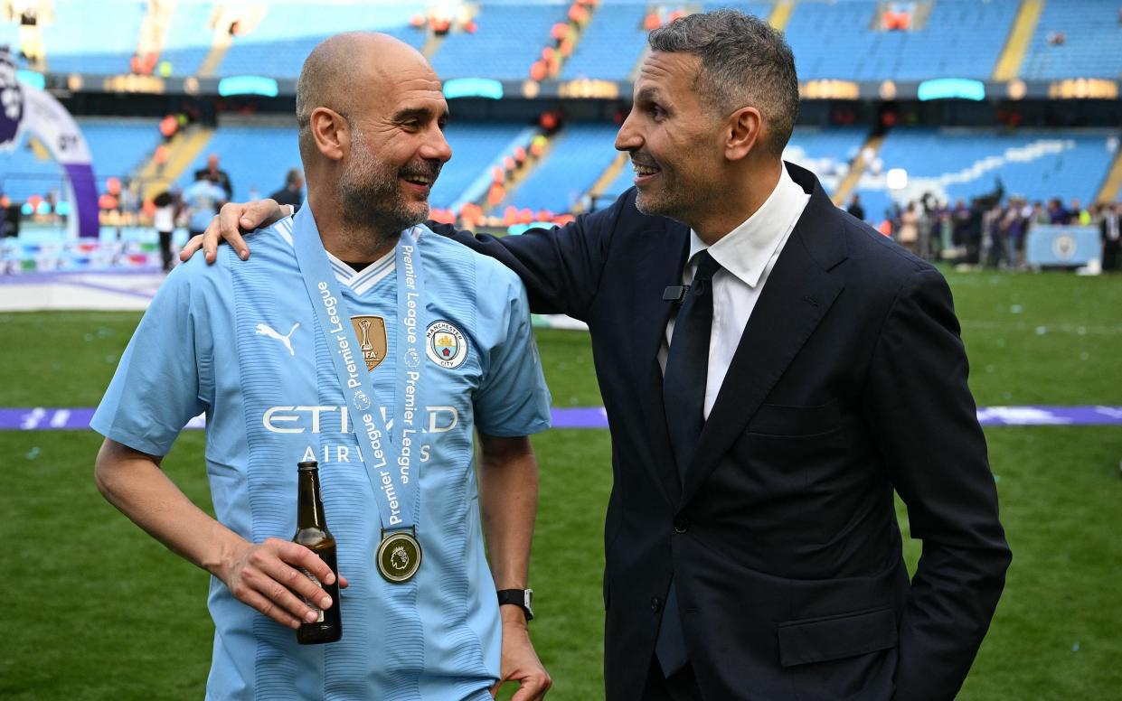 Pep Guardiola and Manchester City Emirati chairman Khaldoon al-Mubarak after the English Premier League football win in May