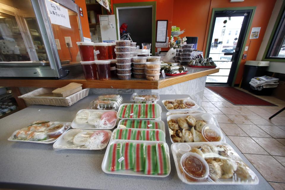 This March 13, 2014 photo shows the interior of the Dessert Shop and Bakery in Lowell, Mass., featuring Cambodian foods and packed lunches to go. Lowell now is home to one of the largest populations of Cambodians outside Cambodia. (AP Photo/Elise Amendola)