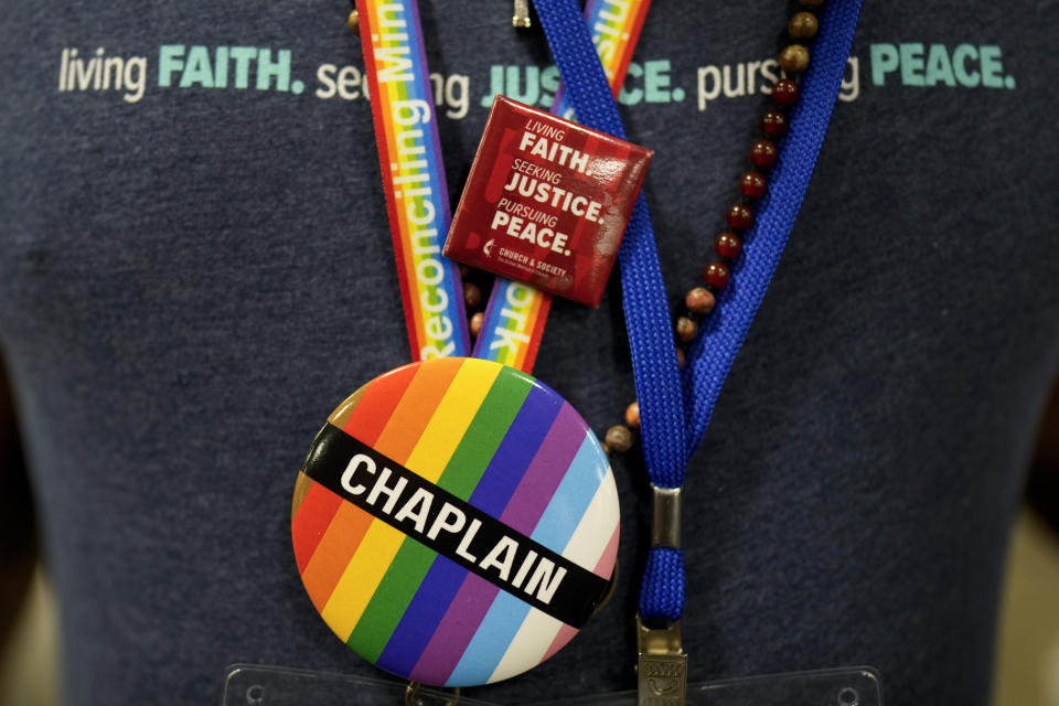 A convention goer wears a button supporting LGBTQ clergy at the United Methodist Church General Conference Wednesday, May 1, 2024, in Charlotte, N.C. United Methodist delegates repealed their church’s longstanding ban on LGBTQ clergy with no debate on Wednesday, removing a rule forbidding “self-avowed practicing homosexuals” from being ordained or appointed as ministers. (AP Photo/Chris Carlson)