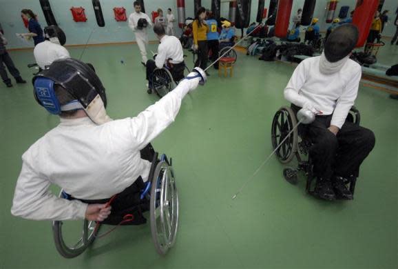 Disabled men take part in a wheelchair fencing training session in Russia's far eastern city of Vladivostok, Russia March 11, 2011. The Kovcheg (Ark) organization, which supports disabled people, and local authorities held a series of sporting events to popularize Paralympic sports.