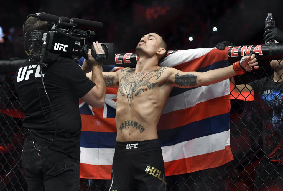 Featherweight champ Max Holloway fully intends on defending both belts if he beats Khabib Nurmagomedov on Saturday at UFC 223 for the lightweight title. (AP)