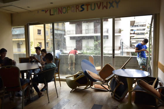 Part of the hotel’s dining room has been turned into an activity center for refugee youth to gather for games, language tutor sessions and hanging out.