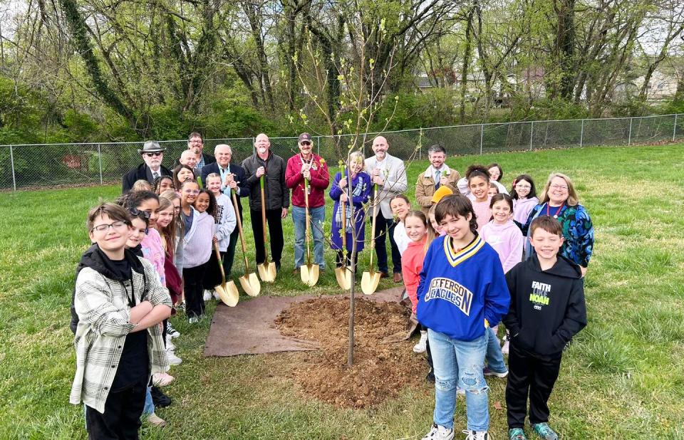 After planting a tulip poplar tree for Arbor Day, Glenwood Elementary School third- and fourth-grade students in the Cub Choir pose for a photo on Arbor Day.