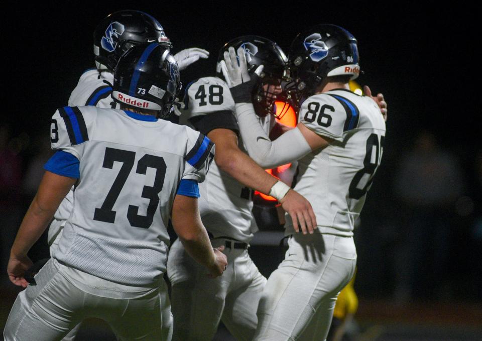 Central Bucks South's Sean Moskowitz (48) celebrates his touchdown with teammates Jake Menaker (86) and Kieran Padgett (73) against Central Bucks West during their football game in Doylestown on Friday, Oct. 20, 2023.

[Daniella Heminghaus | Bucks County Courier Times]