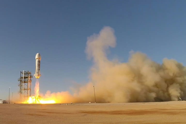 This image obtained November 24, 2015 from Bezos's space firm Blue Origin, shows the world's first reusable rocket as it flies from a launch site in West Texas