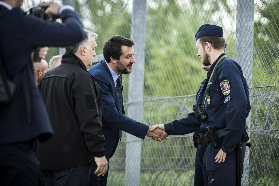 In this handout photo provided by the Hungarian Prime Minister's Press Office shows Hungarian Prime Minister Viktor Orban, left, and Italian Interior Minister Matteo Salvini, second left, during their visit at the Hungarian-Serbian border near Roszke, 180 kms southeast of Budapest, Hungary, Thursday, May 2, 2019. (Balazs Szecsodi/Hungarian Prime Minister's Press Office/MTI via AP)