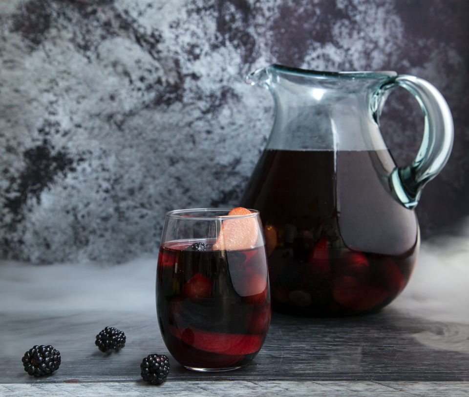 <p><strong>Ingredients</strong></p><p>1 bottle of 9 Lives Cabernet Sauvignon or 9 Lives Malbec<br>.5 cup pomegranate, cherry, or blueberry juice<br>.25 cup The Famous Grouse Smoky Black<br>.25 cup pure maple syrup, to taste<br>1 cup blackberries<br>2 black plums, chopped into wedges<br>1 cup black grapes, halved</p><p><strong>Instructions</strong></p><p>Add all ingredients to a large pitcher and stir well. Allow sangria to sit at least 2 hours before serving over ice. Add some of the alcohol-soaked fruit to each glass. *Add dry ice for the extra Halloween effect.</p><p><strong>More: </strong><a href="http://www.townandcountrymag.com/leisure/g1025/sangria-recipes/" rel="nofollow noopener" target="_blank" data-ylk="slk:Sangria Recipes for Every Season;elm:context_link;itc:0;sec:content-canvas" class="link ">Sangria Recipes for Every Season</a></p>