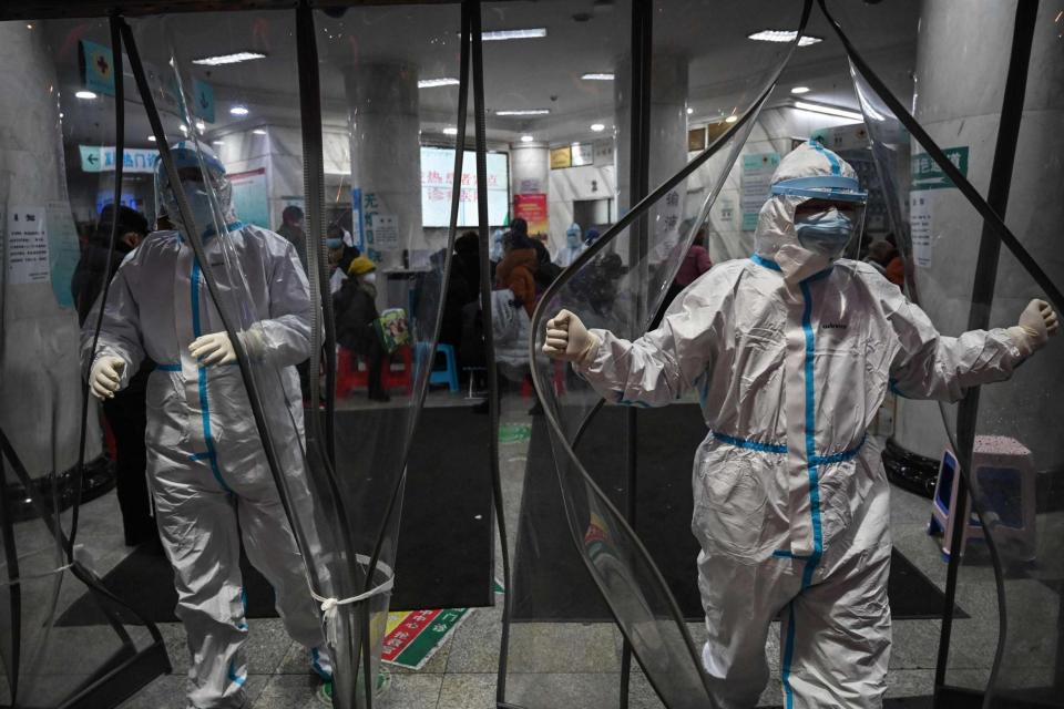 Medical staff members wearing protective clothing at a hospital in Wuhan, the coronavirus epicentre (AFP via Getty Images)