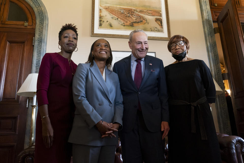 Senate Majority Leader Chuck Schumer, D-N.Y., meets with Laphonza Butler and her family before she is sworn in to succeed the late Sen. Dianne Feinstein, D-Calif., Tuesday, Oct. 3, 2023, on Capitol Hill in Washington. (AP Photo/Stephanie Scarbrough)