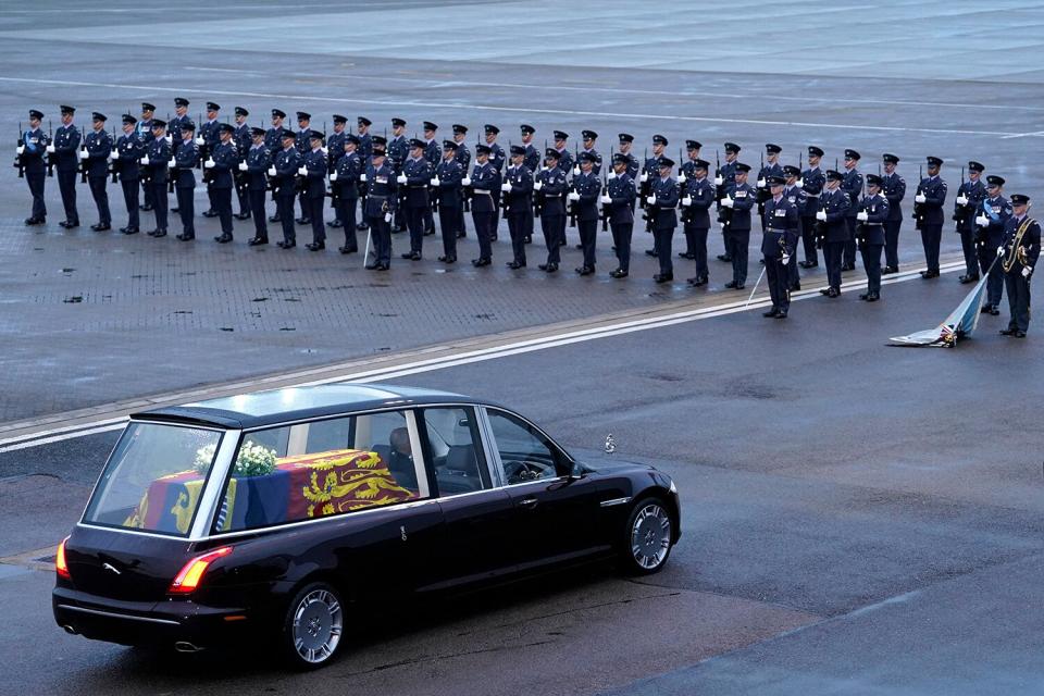 The coffin of Queen Elizabeth II is taken away in the Royal Hearse from the Royal Air Force Northolt airbase on September 13, 2022, to travel to Buckingham Palace.