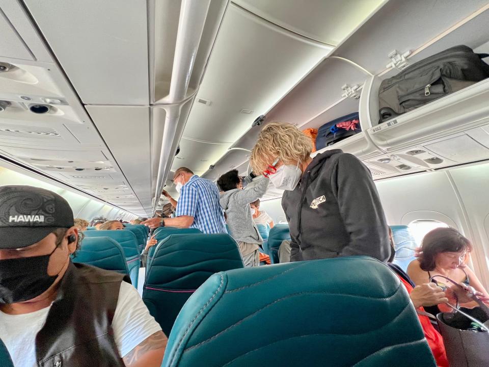 Other passengers taking their seats on a flight
