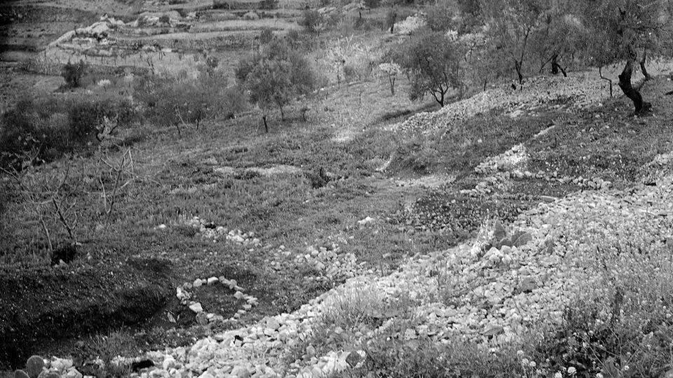 A mass grave where more than 100 victims of the Deir Yassin massacre were buried in April 1948. The round stone ring is a mass grave for women and the square one is for men. - AP