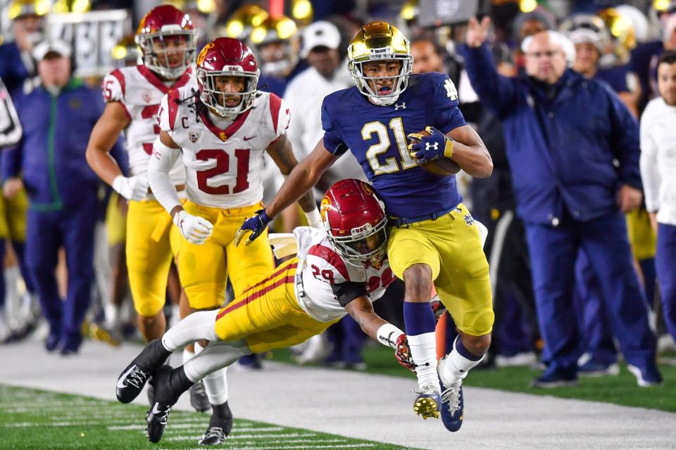 Notre Dame wide receiver Lorenzo Styles Jr. (21) runs past the Southern California defense during their 2021 game at Notre Dame Stadium.