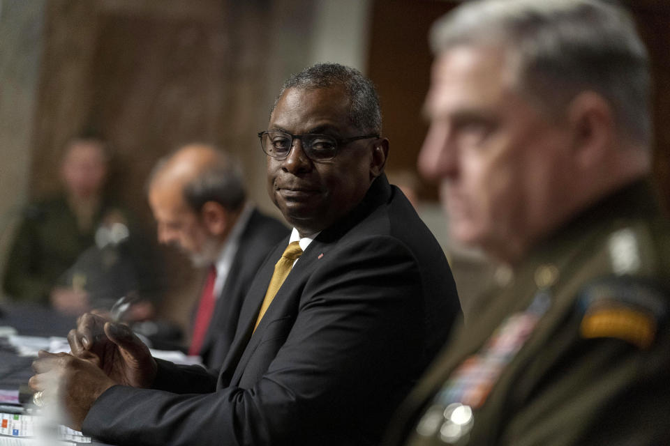 Secretary of Defense Lloyd Austin, center, Chairman of the Joint Chiefs of Staff Gen. Mark Milley, right, and Defense Under Secretary Mike McCord, left, appear at a Senate Armed Services budget hearing on Capitol Hill in Washington, Thursday, June 10, 2021. (AP Photo/Andrew Harnik)