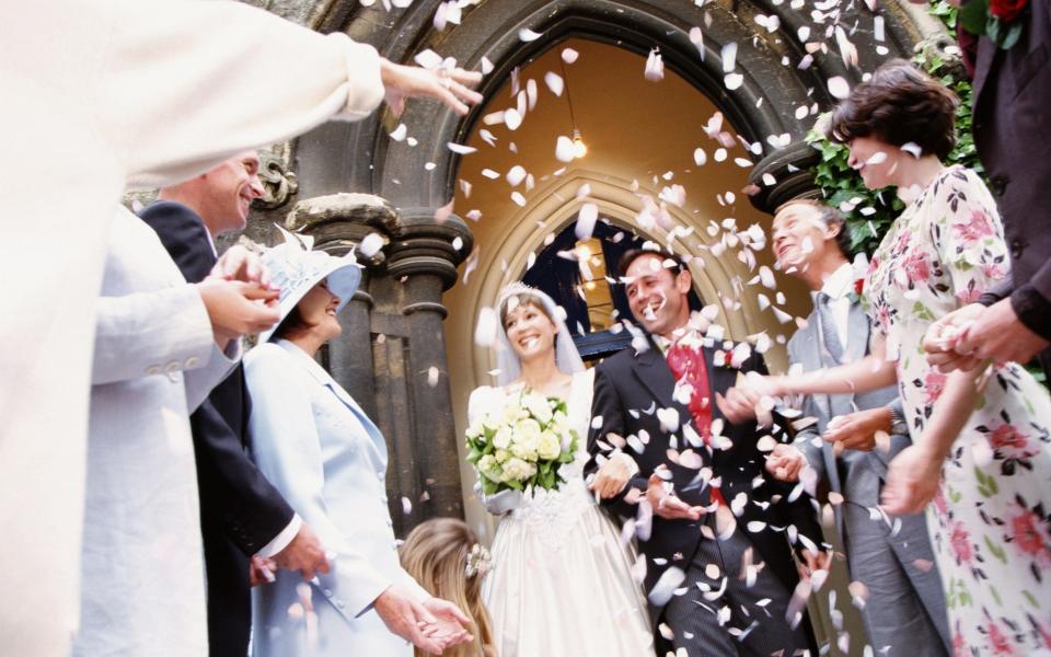 Confetti being thrown at a wedding - Getty Images Fee