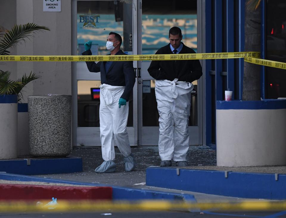 Police investigators work at the Gable House Bowl center after 3 men were killed and 4 injured in a shooting at the bowling alley in Torrance, California, according to police on Jan. 5, 2019. (Photo: Mark Ralston/AFP/Getty Images)