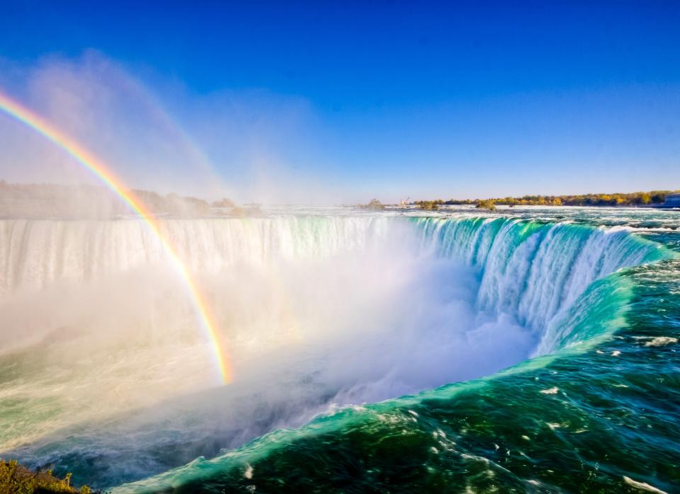 Niagara Falls, New York and Ontario:  Located on the New York and Ontario border, Niagara Falls is one of the largest and most famous waterfalls in the world. Every second, 3,160 tons of water flows over the falls, generating plenty of mist and – you guessed it – a whole lot of rainbows.