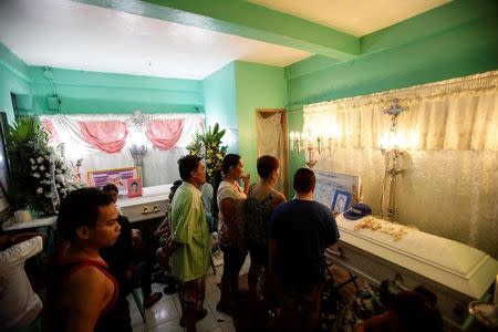 People attend the wake of Michael Siaron in Pasay, Metro Manila, Philippines July 28, 2016. REUTERS/Czar Dancel