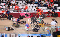 <p>Lotte Kopecky of Team Belgium, Clara Copponi of Team France, Laura Kenny of Team Great Britain, Emily Kay of Team Ireland, Daria Pikulik of Team Poland and Elisa Balsamo of Team Italy crash during the Women's Omnium scratch race, 1 round of 4 of the track cycling on day sixteen of the Tokyo 2020 Olympic Games at Izu Velodrome on August 08, 2021 in Izu, Shizuoka, Japan. (Photo by Justin Setterfield/Getty Images)</p> 