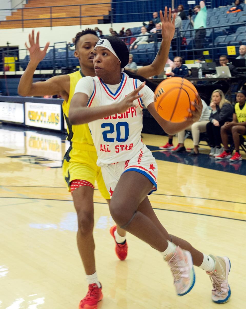 Mississippi's Debreasha Powe of Meridian goes in for two against Alabama's Shaniah Nunn of Fairfield during the Mississippi/Alabama All-Star game at Mississippi College in Clinton, Saturday, March 12, 2022.