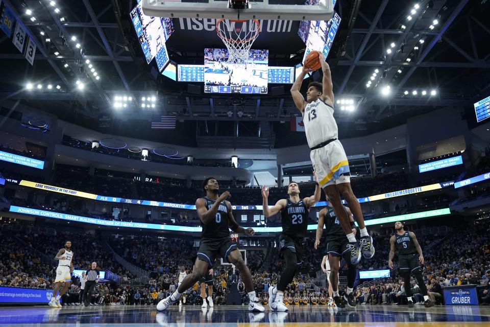 Marquette's Oso Ighodaro dunks during the first half of an NCAA college basketball game against the Villanova Monday, Jan. 15, 2024, in Milwaukee. (AP Photo/Morry Gash)