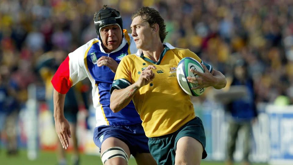 Rogers evades van Lill to score Australia's 21st try against Namibia. - David Davies/PA Images/Getty Images