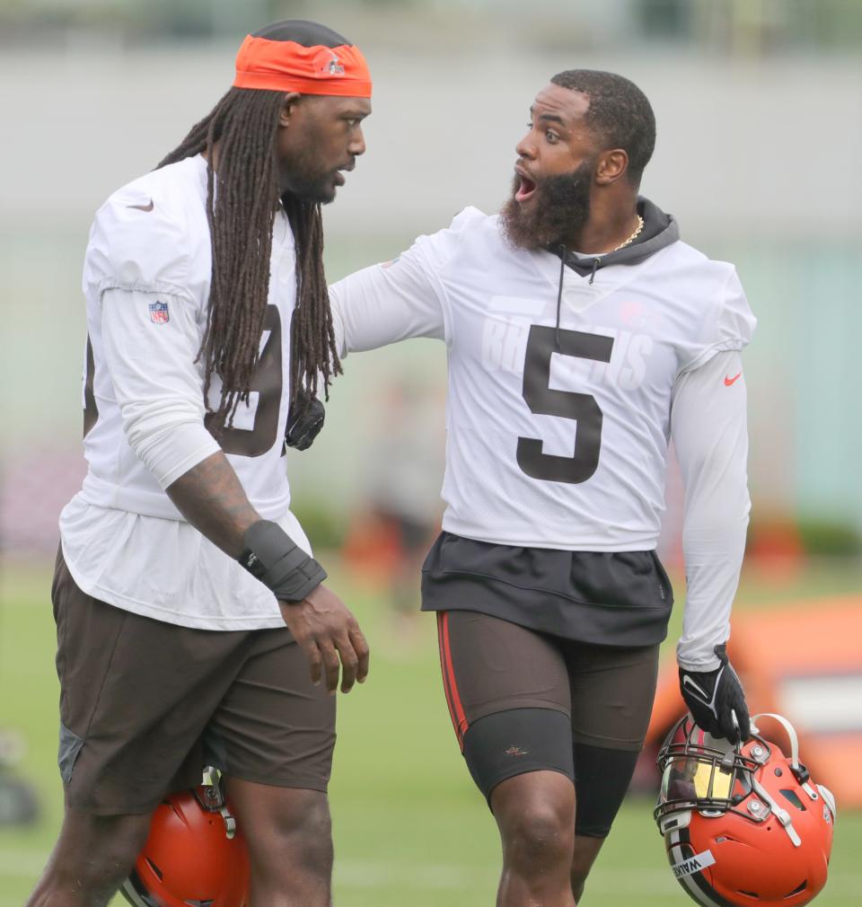 Cleveland Browns defensive end Jadeveon Clowney and linebacker Anthony Walker share a lighter moment during OTA practice on Wednesday, May 25, 2022 in Berea.