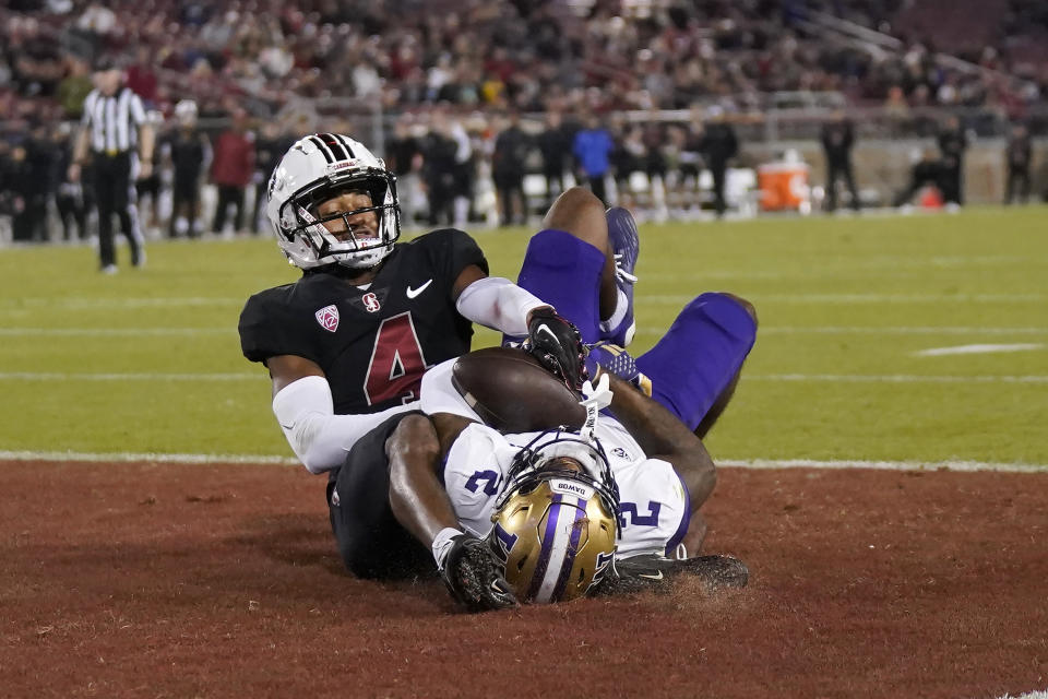 Washington wide receiver Ja'Lynn Polk (2) catches a touchdown pass against Stanford cornerback Zahran Manley (4) during the second half of an NCAA college football game in Stanford, Calif., Saturday, Oct. 28, 2023. (AP Photo/Jeff Chiu)