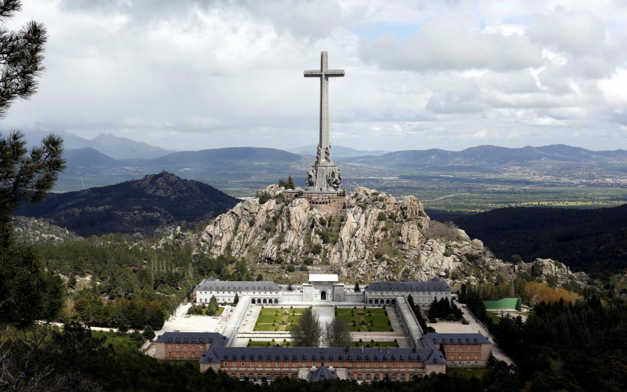 The 150-metre-high cross of the Valle de los Caidos monument where over 30,000 fighters from both sides of Spain's civil war are buried, is seen outside Madrid - REUTERS