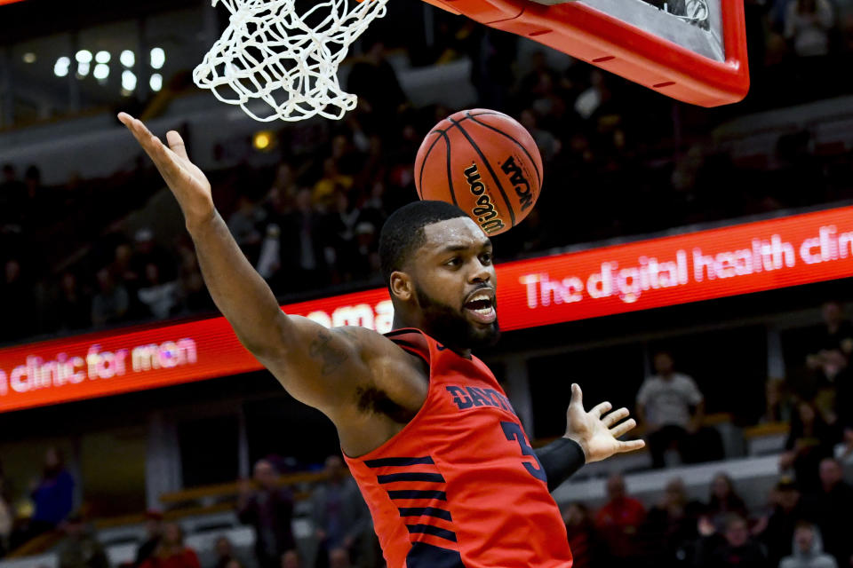 FILE - In this Dec. 21, 2019, file photo, Dayton guard Trey Landers (3) scores in the second half of an NCAA college basketball game against Colorado, in Chicago. This will always be remembered as the Final Four that never was, called off because of the coronavirus outbreak and one of the most sobering reminders of what this pandemic has cost the world of sports. “I wish that all of this was just a dream I could wake up from," senior guard Trey Landers tweeted after the shocking word came down three weeks ago that the season was over. "Wish I could play one more game with my brothers.” (AP Photo/Matt Marton, File)