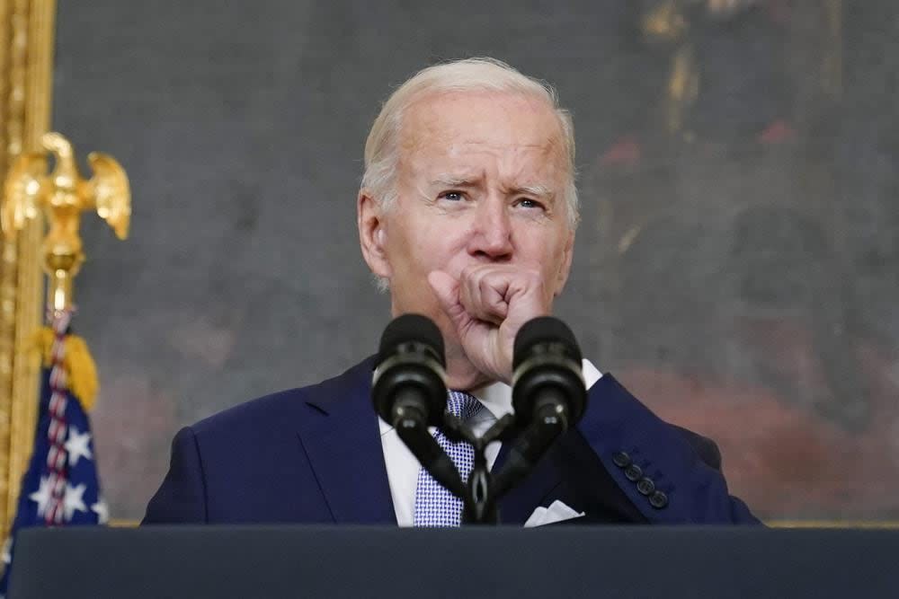 FILE – President Joe Biden coughs as he speaks about “The Inflation Reduction Act of 2022” in the State Dining Room of the White House in Washington, Thursday, July 28, 2022. Biden tested positive for COVID-19 again Saturday, July 30, slightly more than three days after he was cleared to exit coronavirus isolation, the White House said, in a rare case of “rebound” following treatment with an anti-viral drug. (AP Photo/Susan Walsh, File)