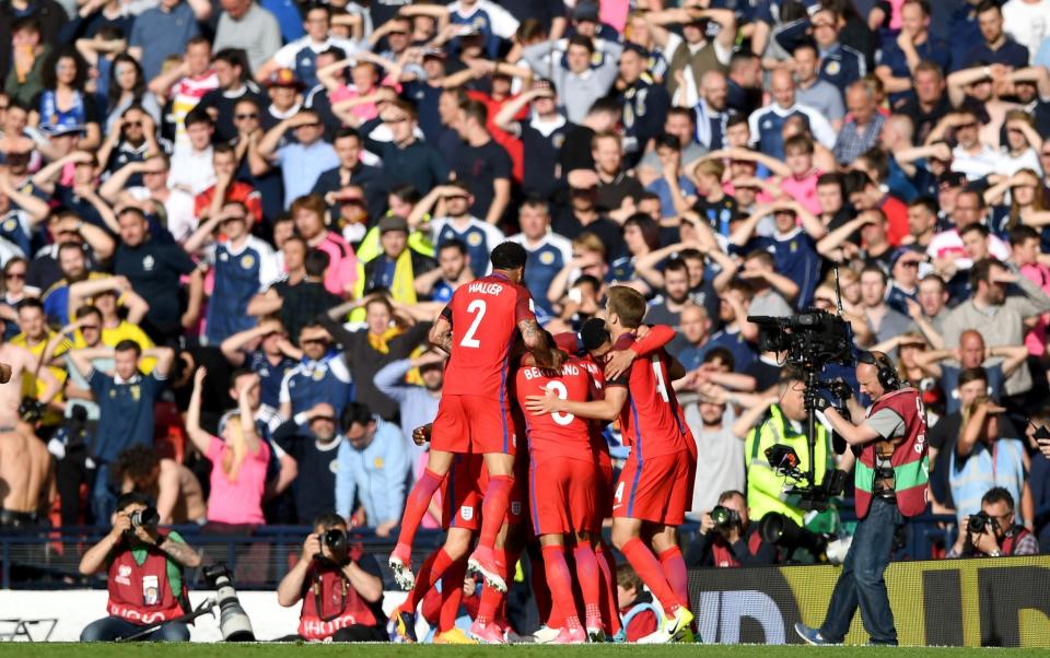 Harry Kane of England celebrates scoring his sides second goal with his team mates during the FIFA 2018 World Cup Qualifier between Scotland and England at Hampden Park - Shaun Botterill/Getty Images