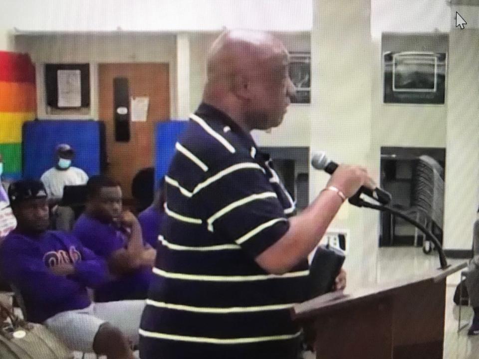 Resident Darryl Greene holds his phone playing "Back Stabbers" by the O'Jays to underscore his opposition to the Teaneck Board of Education for proposing to put Superintendent Christopher Irving on leave one year into his five-year contract. Wednesday, July 14, 2021.
