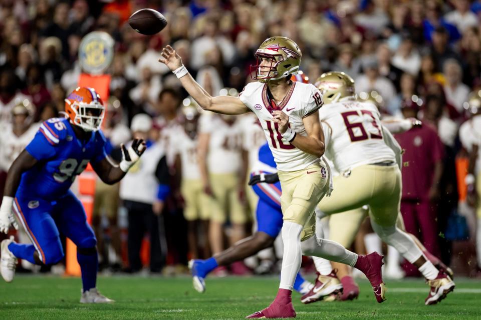 Florida State Seminoles quarterback Tate Rodemaker (18) throws the ball during the first half against the Florida Gators at Steve Spurrier Field at Ben Hill Griffin Stadium in Gainesville, FL on Saturday, November 25, 2023. [Matt Pendleton/Gainesville Sun]