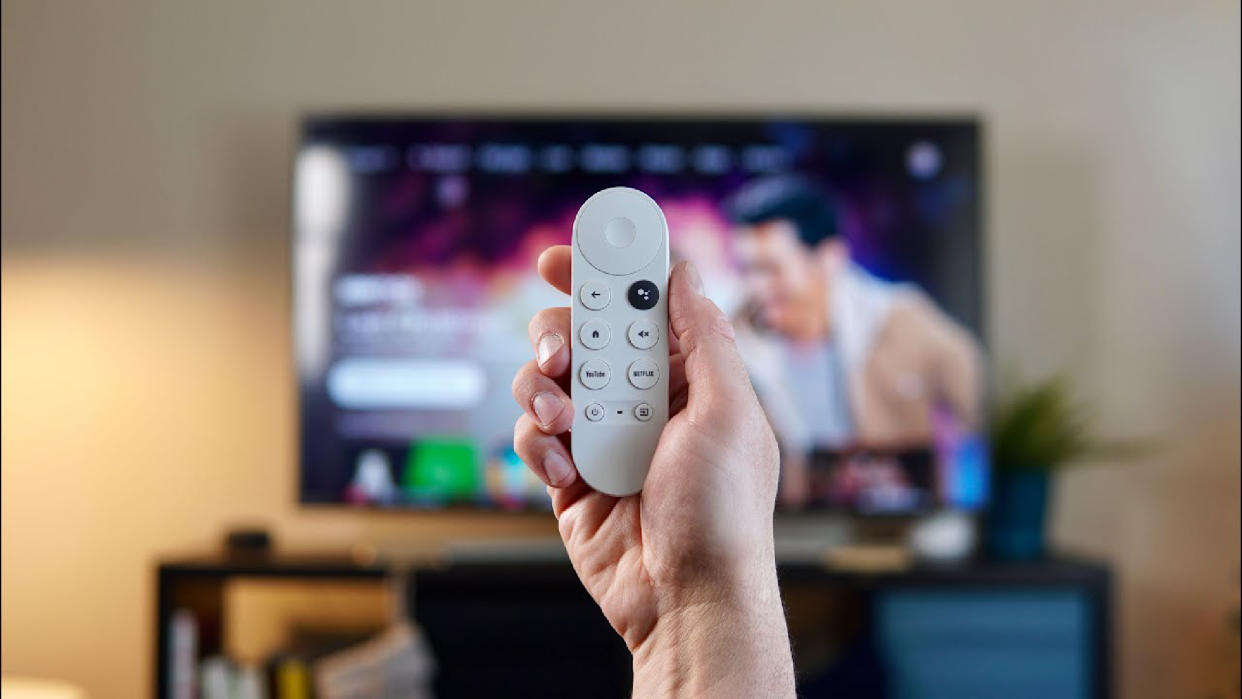  Google TV remote in front of TV. 