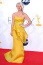 "Big Bang Theory" babe Kaley Cuoco popped a pose in a bright yellow peplum gown by Angel Sanchez. A messy side braid and dark nails completed her ho-hum ensemble.
