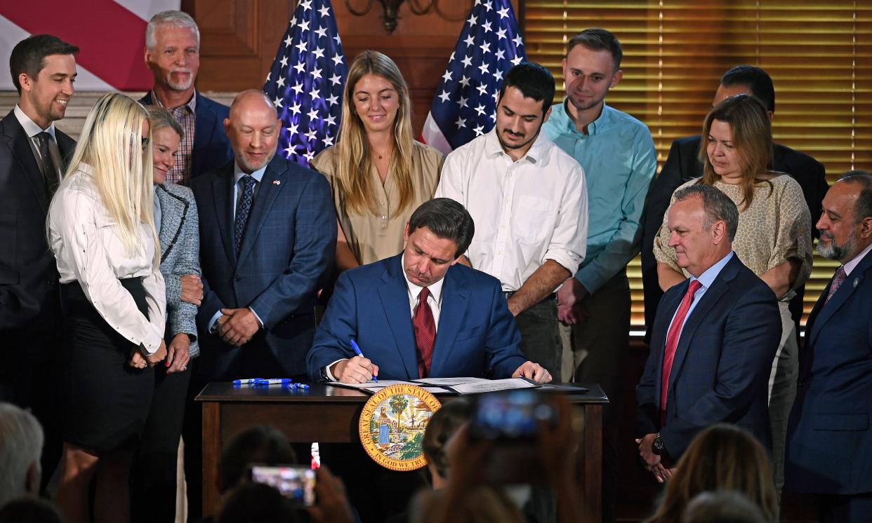 Gov. Ron DeSantis signing legislation impacting the state's colleges and universities on Monday, May 15th, 2023 at Sarasota's New College of Florida. Among the bills signed was SB 266, which is being challenged in a new lawsuit. Among the plaintiffs are New College professors, students and a nonprofit group.