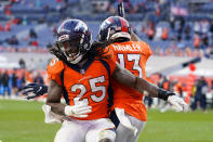 Denver Broncos running back Melvin Gordon (25) celebrates his rushing touchdown with teammate K.J. Hamler (13) during the second half of an NFL football game against the Miami Dolphins, Sunday, Nov. 22, 2020, in Denver. (AP Photo/David Zalubowski)