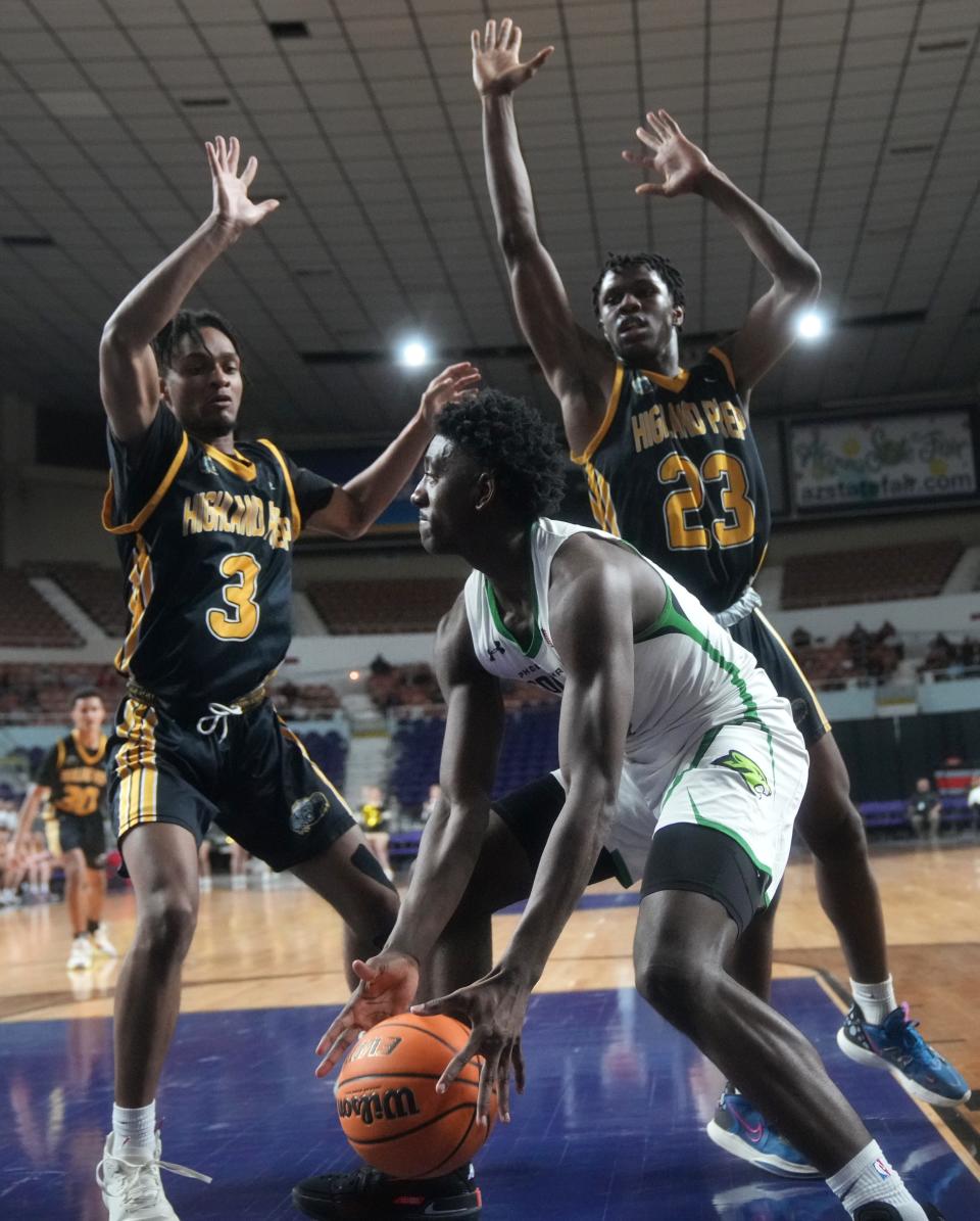 Feb 24, 2023; Phoenix, AZ, USA; Phoenix Christian Cougars guard Tommy Randolph (1) tries to get past the defense of Highland Prep Honey Badgers forward Niko Bey (3) and guard Presley Ibeh (23) at Arizona Veterans Memorial Coliseum. 