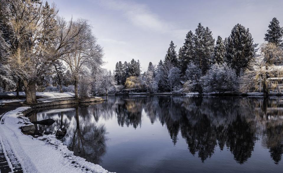 snowy morning on deschutes river in bend, oregon