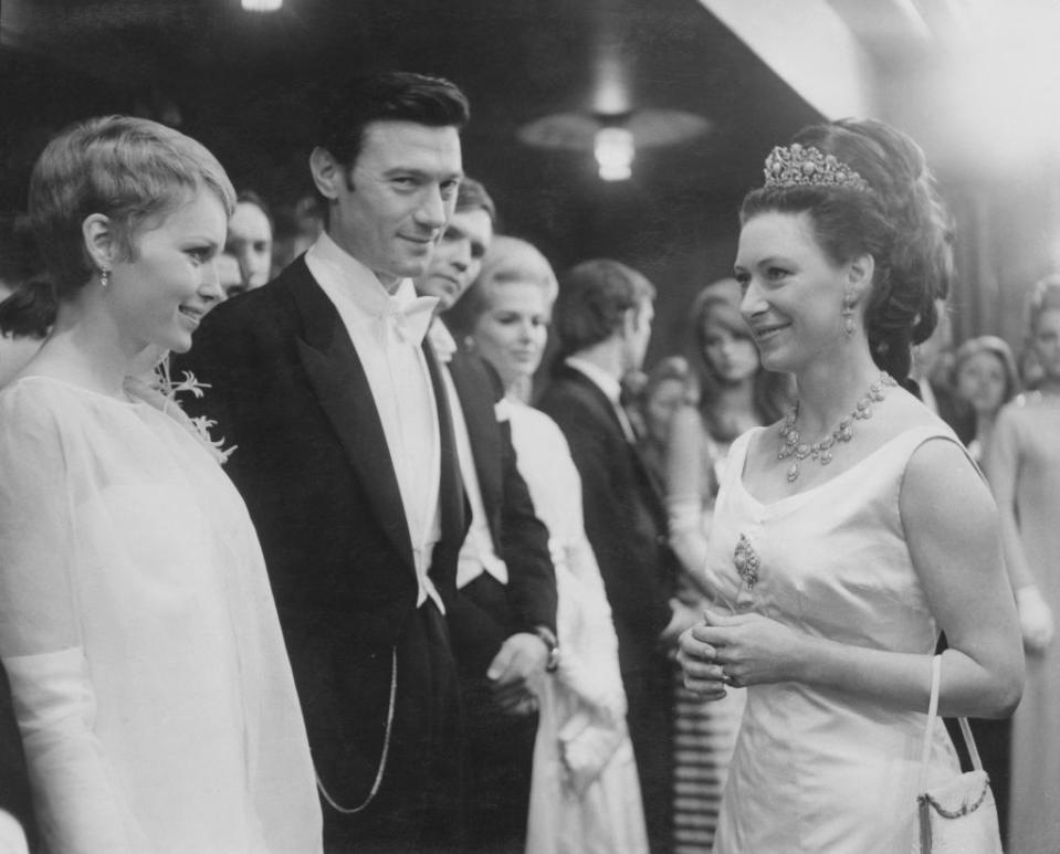 <p>Farrow wears a white chiffon evening gown to meet Princess Margaret in 1967. The Princess greeted Farrow and her costar, Laurence Harvey, at the London premiere of their film <em>The Taming of the Shrew. </em></p>