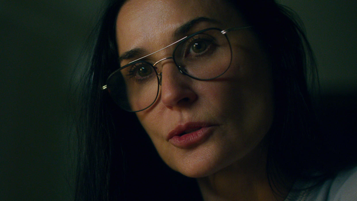  Demi Moore shown in mid-conversation in Songbird. 