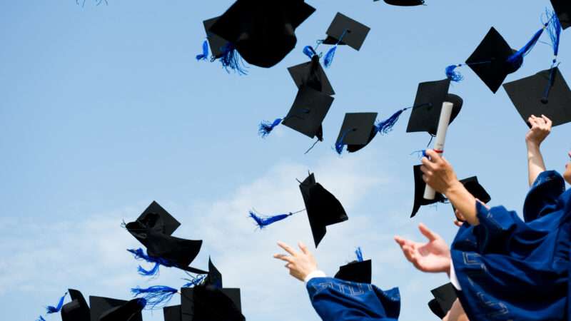 Graduates throwing their caps in the air