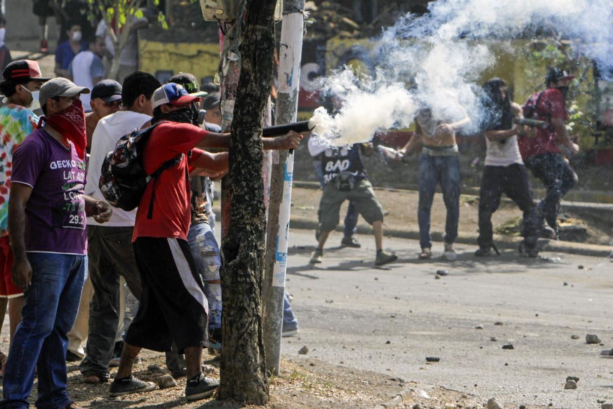 Students clash with riot police during protests in Managua, Nicaragua on Saturday: AFP/Getty Images