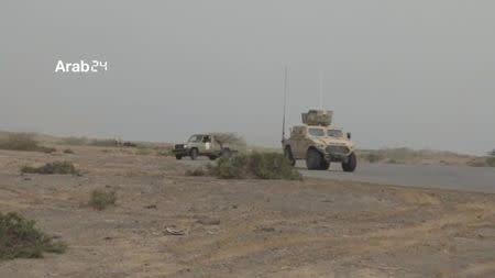 Military vehicles are seen near the airport on the outskirts of Hodeidah, Yemen, June 20, 2018 in this still image taken from video. ARAB 24 via REUTERS