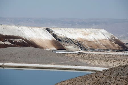 A collapsed wall of a reservoir holding a highly acidic wastewater is seen in Mishor Rotem, in Southern Israel July 4, 2017. REUTERS/Baz Ratner